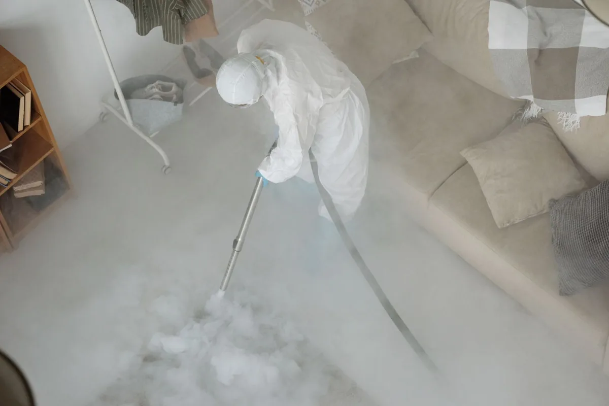 Biohazard cleanup technician in protective equipment, Hardwick, GA